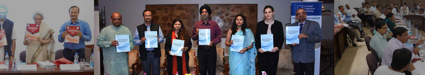 Presenters holding report copies after a panel discussion